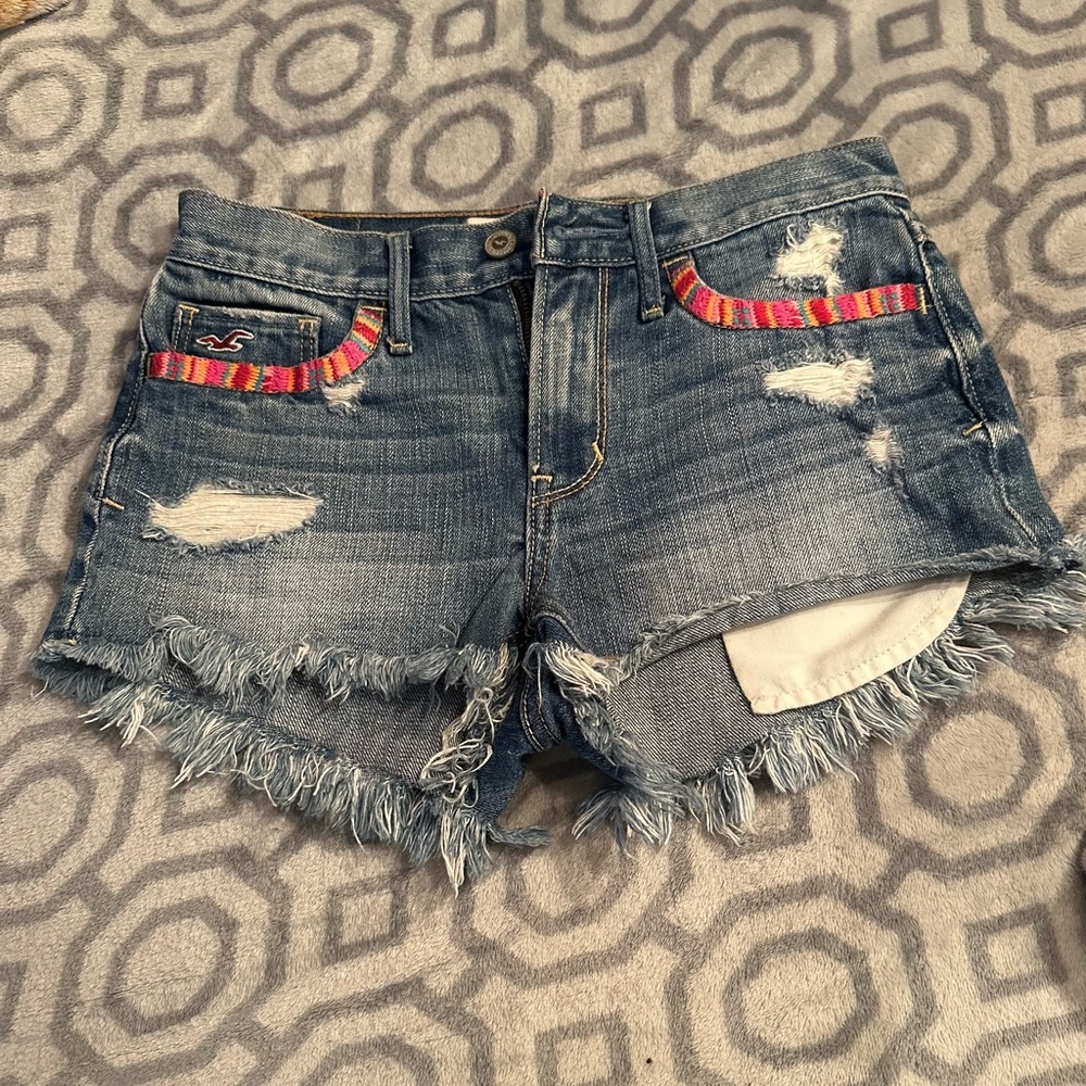 Hollister Mid-Blue Distressed Denim Cutoff Shorts with Color-Striped Pocket Trim